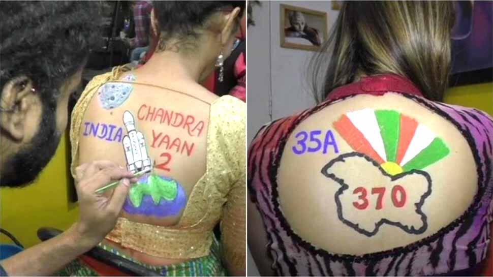 இளம் பெண்களின் முதுகில் ஓவியங்களாக மோடி அரசின் சாதனைகள்...! இளம் பெண்களின் முதுகில் ஓவியங்களாக மோடி அரசின் சாதனைகள்...!