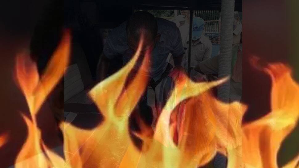 அசுரன் பாணியில் நில ஆக்கிரமிப்பு : விவசாயி தீக்குளிக்க முயற்சி