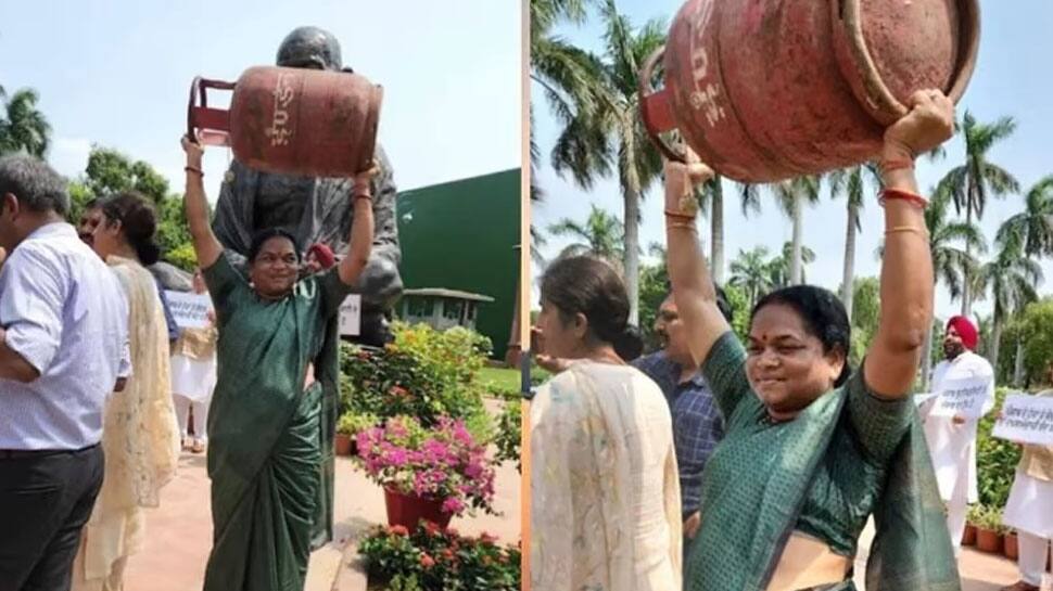 மோடி அரசை கண்டித்து 'பாகுபலி' ஸ்டைலில் சிலிண்டரை தூங்கிய பெண் எம்.பி