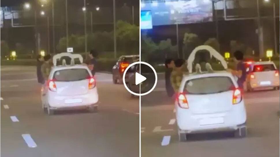 Video shows man doing push ups on top of moving car goes viral | ஒரே ...