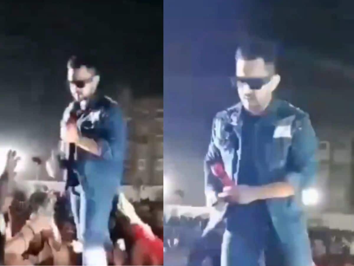 ரசிகரின் போனை பிடுங்கி விசிறியடித்த பிரபல பாடகர்..வைரல் வீடியோ!