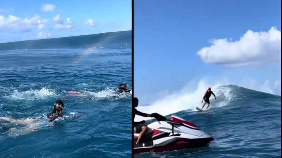 சுனாமி போன்ற அலையில் ஸ்விம்மிங்கை போடும் மக்கள்..பயமே இல்லையா? வைரல் வீடியோ..