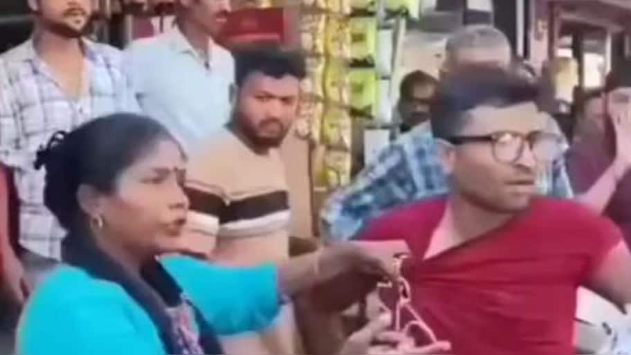 கணவனை ரோட்டில் இழுத்து போட்டு அடித்த மனைவி..Why this கொலவெறி? வைரல் வீடியோ..