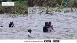 வெள்ளத்தில் அடித்துச் செல்லப்பட்ட  சிறுமியைக் காப்பாற்றிய இளைஞர்