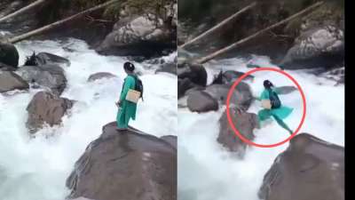 கடும் வெள்ளத்தை தாண்டி குதித்த பெண்..எதற்காக தெரியுமா? வைரல் வீடியோவை பாருங்க..