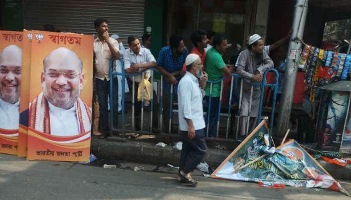 மேற்குவங்கத்தில் அமித்ஷா படம் பதித்த பதாகைகளை அகற்றம்...