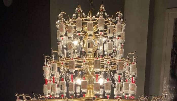 COVID Chandelier: காலி கோவிட் தடுப்பூசி குப்பிகளில் இருந்து தயாரிக்கப்பட்ட சரவிளக்கு