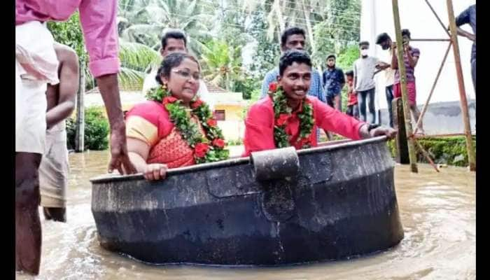 Viral Video: பாத்திரத்தில் 'படகு' போல் பயணித்து கரை சேர்ந்த கேரள தம்பதிகள்..!! title=