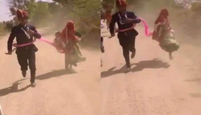 Funny Wedding Video: Bride and Groom run behind Vehicle