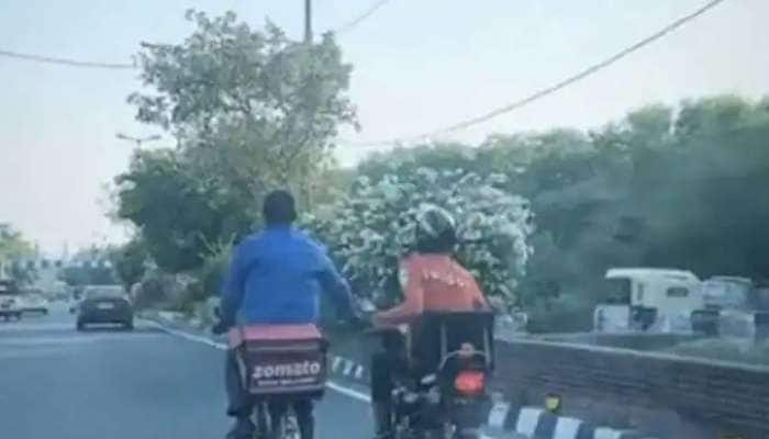Viral Video: Swiggy Delivery person helps Zomato Executive in Scorching Heat, Melts Internet