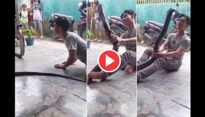 Viral Video: ராஜநாகத்துடன் ஒரு உல்லாச நடனம் ஆடும் அதிசய இளைஞர்! title=