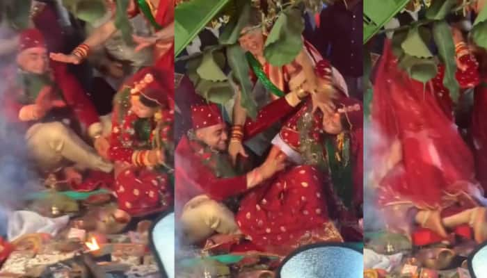 Viral Video: திருமண மேடையில் கட்டிபிடித்து உருண்ட மணமக்கள்... இதுதான் செல்ல சண்டையோ! title=