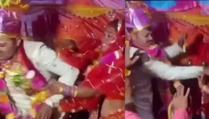 மேடையில் மணமக்கள் செய்த வேலை.. யார் தடுத்தும் நிறுத்தல: வேற லெவல் வைரல் வீடியோ title=