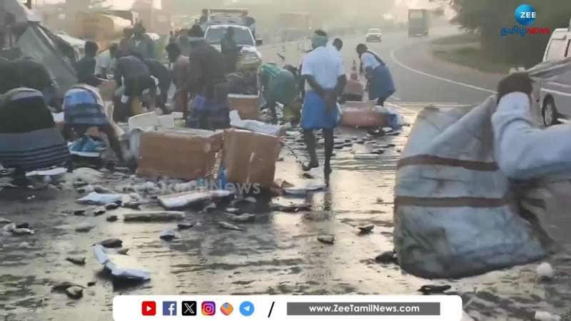 Vehicle with fishes Overturn: People take away the scattered Fishes